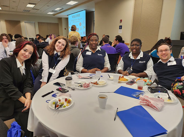 The 2023 Ethics Bowl team poses at an event