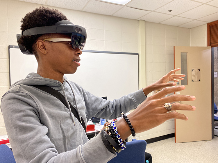 A student tries an augmented reality headset.