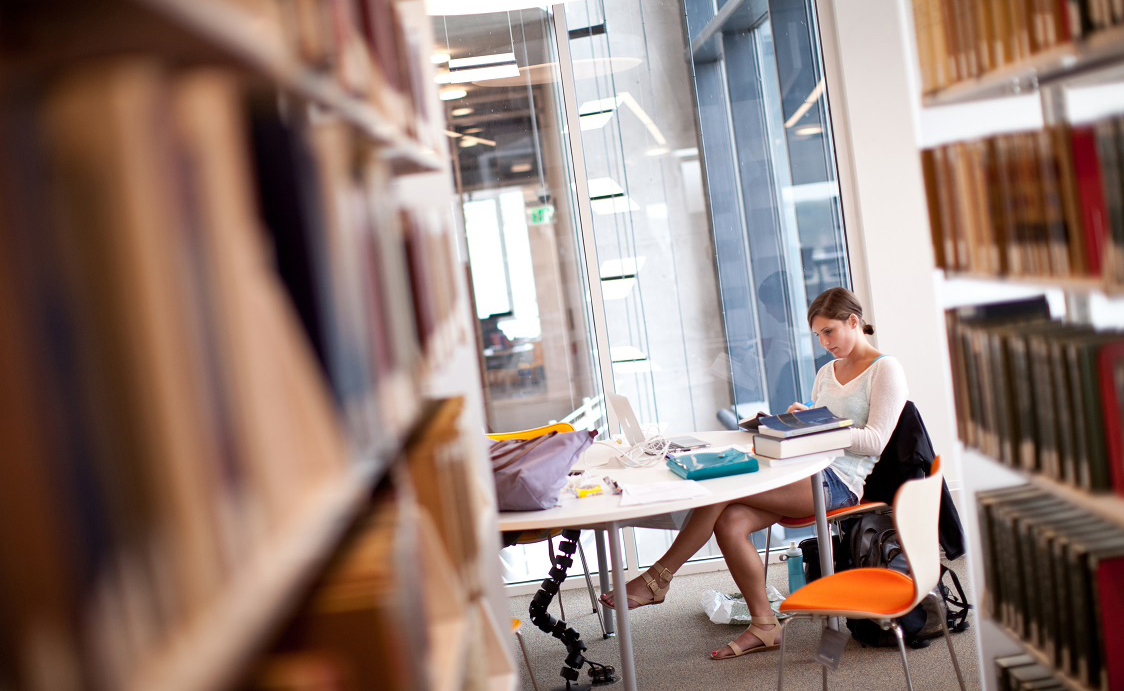 student in library