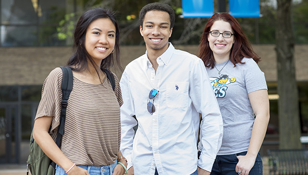 three UBalt students standing side by side