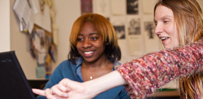 a staff member providing academic support to a student