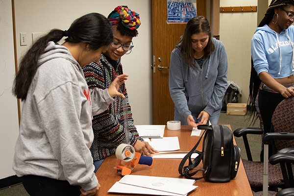 group works on building obstacle course