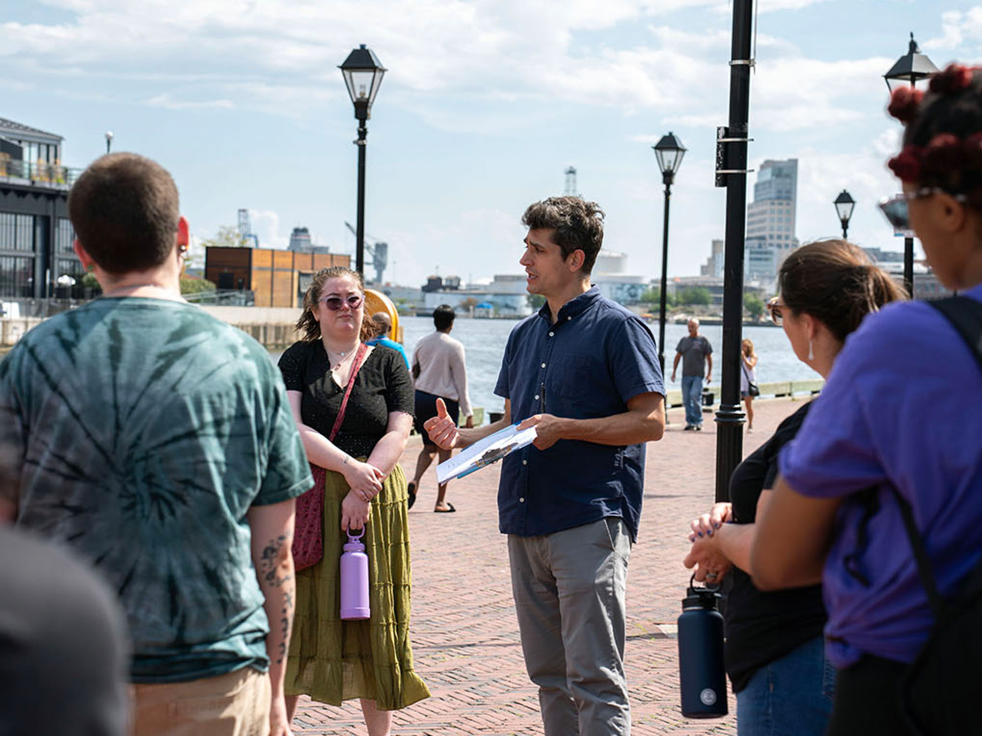 Joshua Davis speaks to his students during a tour of Fells Point.