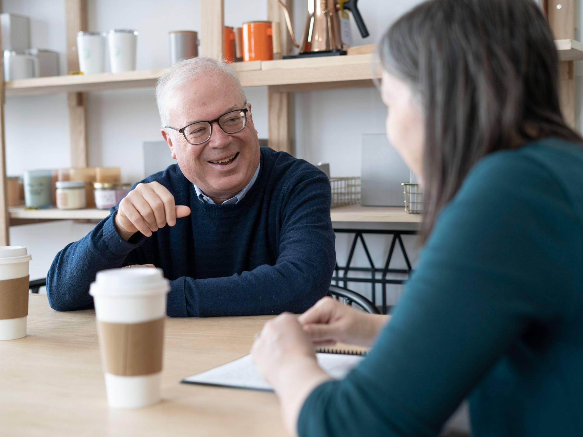 David Lingelbach laughs while sharing about his research during an interview.