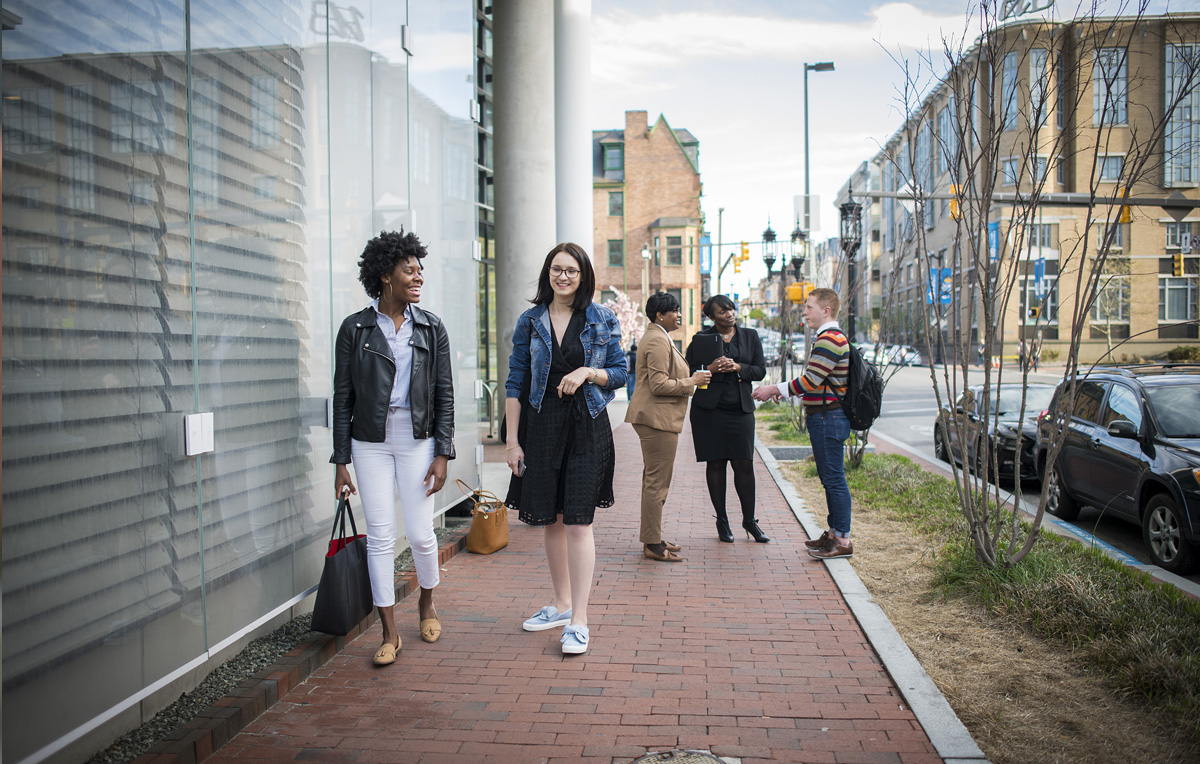 Several Univerity of Baltimore students walking on North Charles Street.