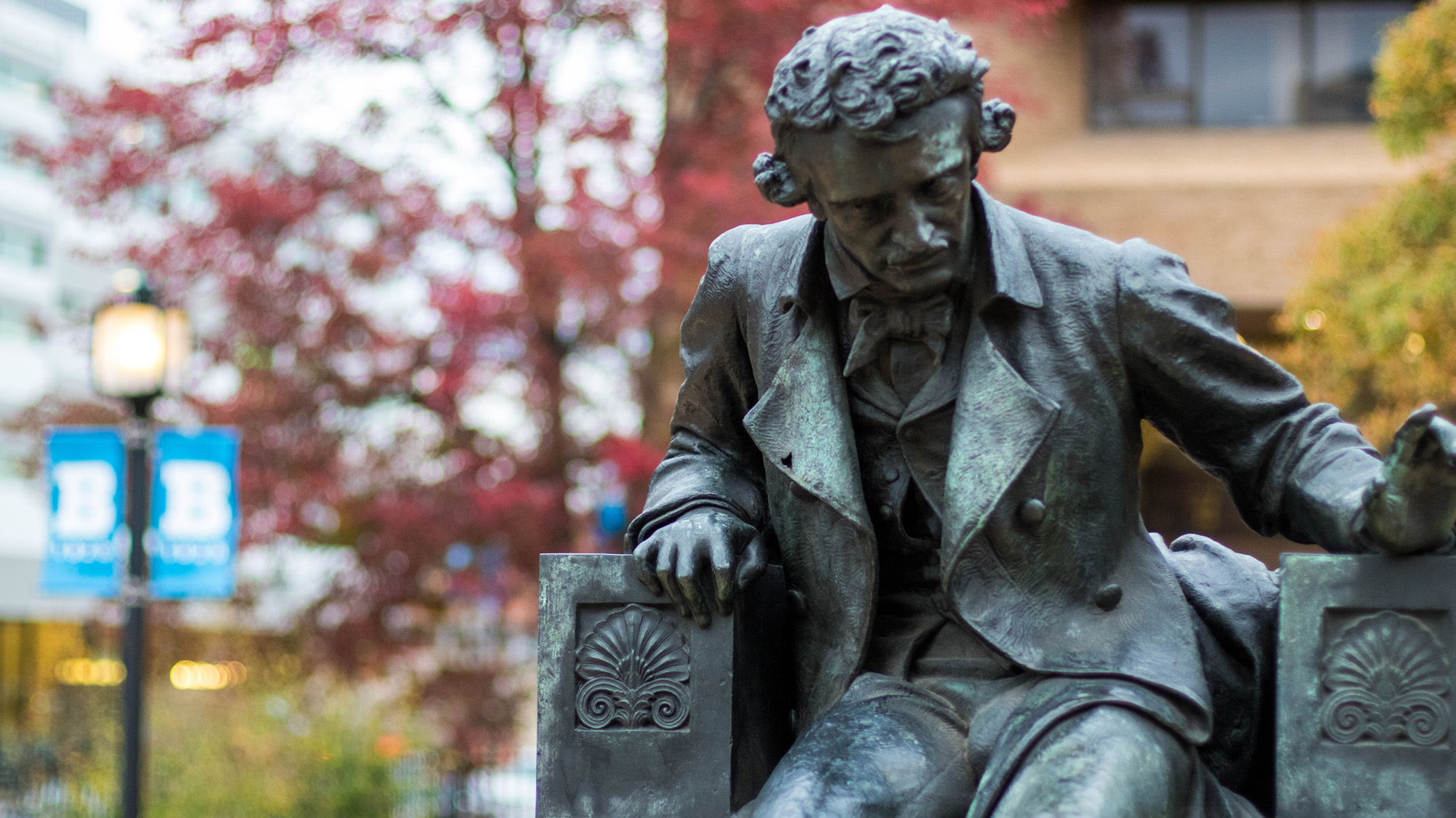 image of the statue of Edgar Allen Poe on the campus of the University of Baltimore