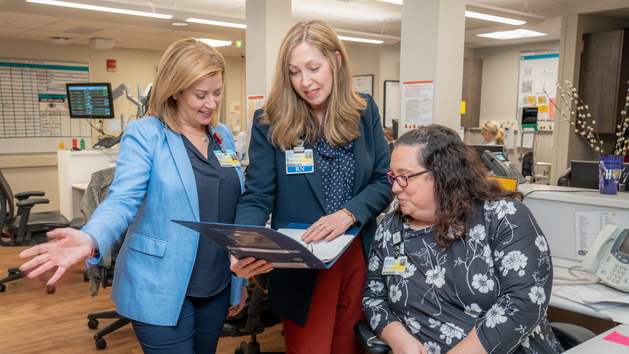 University of Maryland School of Nursing image of three alumna in a clinical setting.