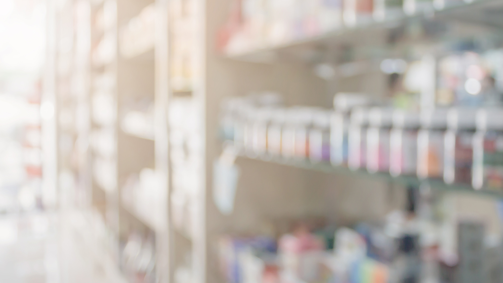 a washed out image of a pharmacy shelves with medications